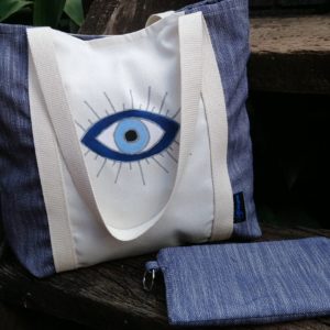 Handpainted evil eye tote bag made by 4 keyps with matching pouch.