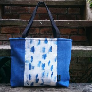 Handpainted tote bag with recycled denim side panels..