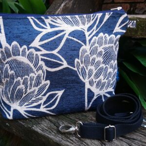 blue protea crossbody bag with adjustable cotton webbing strap and zip closure, a limited editiion bag